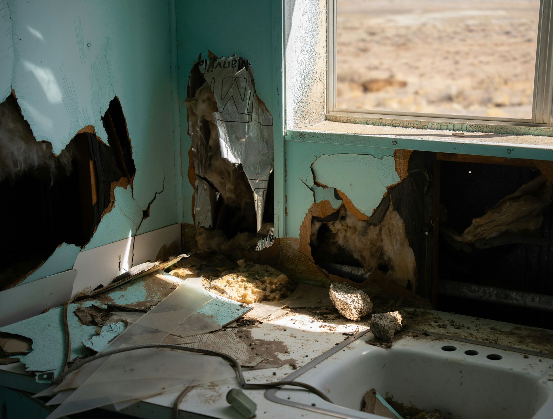a kitchen that has been gutted and has a sink in it